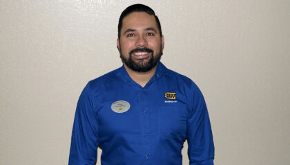 His career has enabled him to provide shoes, school supplies and more for his home village.