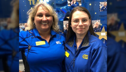 An employee with a passion for sign language is passing it along.