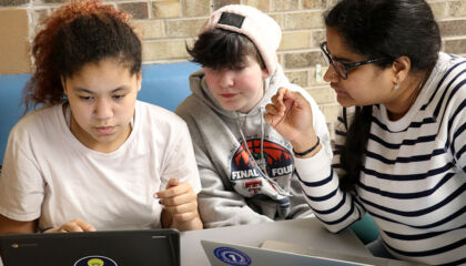 Adults and teens partner to solve problems.