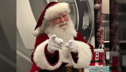 He has a white beard and big smile for all who visit.